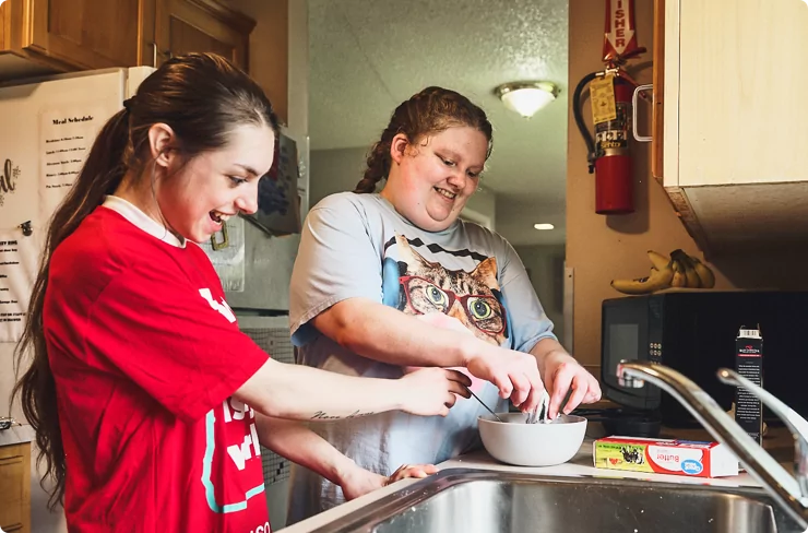 young-adult-with-developmental-disabilities-works-on-life-skills-through-cooking